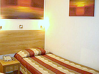 A triple room at Queens Park Hotel