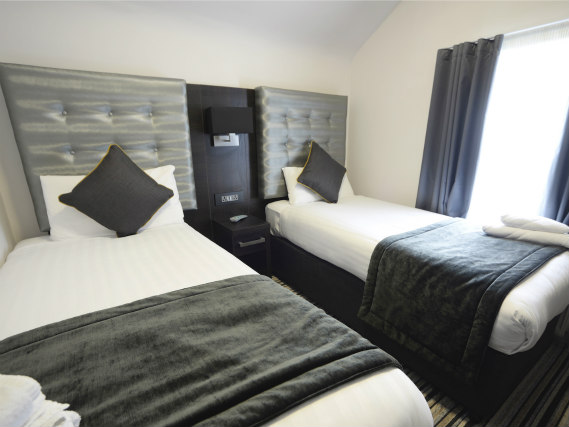 A spacious twin room at Airways Hotel