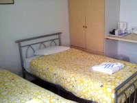 A specious twin room at Lindal Hotel