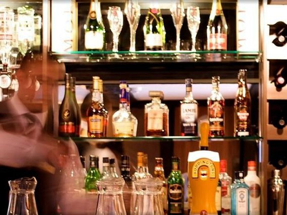 Relax in the bar at The Tudor Lodge after a busy day