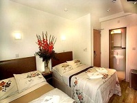 A typical  bedroom at the Notting Hill Gate Hotel