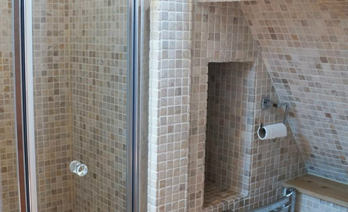 A bathroom at At Home B&B