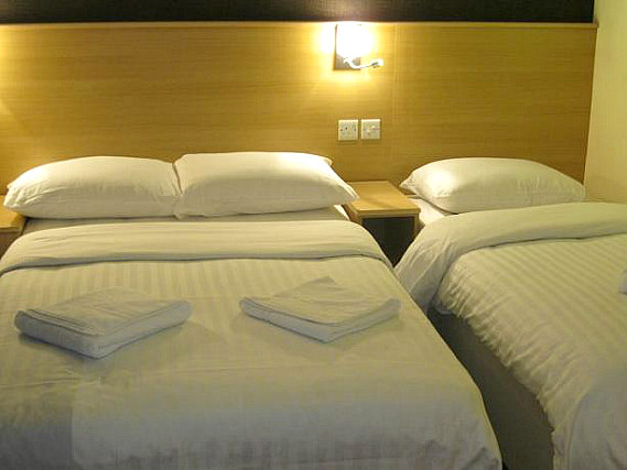 A typical triple room at Mina House Hotel London