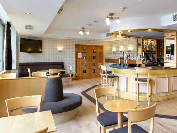 Relax in the bar at London Wembley International Hotel after a busy day