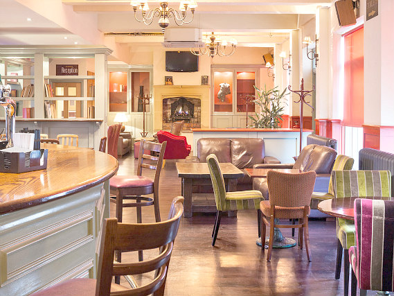 Relax in the bar at Custom House Hotel after a busy day