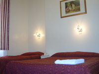 A Typical Triple Room at Colliers Hotel