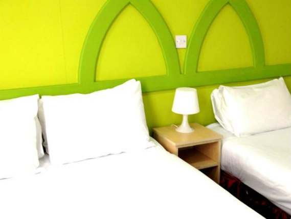 A typical triple room at Clapham South Belvedere Hotel