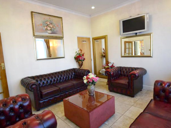 Watch TV in the lounge at Cranbrook Hotel