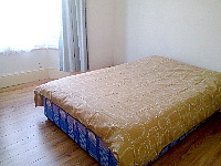 An airy but basic double room