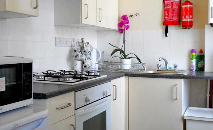 A kitchen at Bowcity Apartments